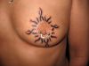 tribal sun chest tattoo